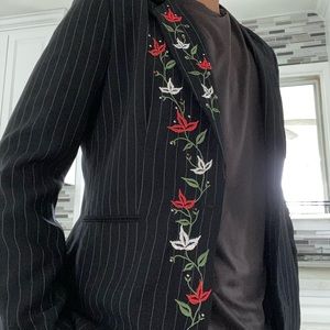 An embroidered formal men’s dress jacket
